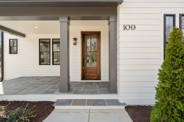 doorway to property featuring a porch