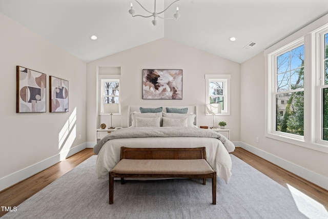 bedroom featuring baseboards, a chandelier, vaulted ceiling, recessed lighting, and wood finished floors