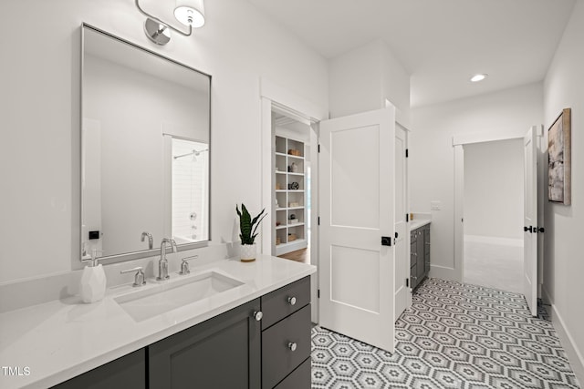 full bath with recessed lighting, baseboards, and vanity