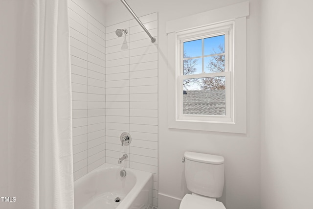 full bathroom featuring toilet and shower / bathtub combination with curtain