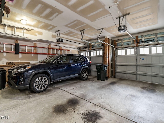 garage featuring a garage door opener