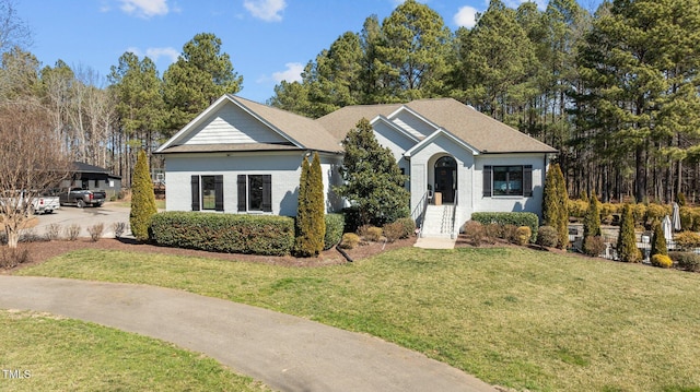 view of front facade featuring a front lawn and brick siding