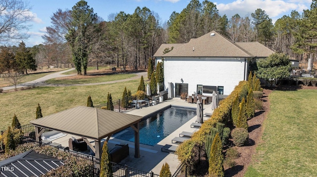 view of pool with a fenced in pool, a lawn, a patio, and fence