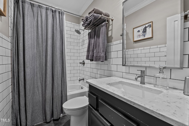 full bath featuring toilet, ornamental molding, shower / bath combo with shower curtain, vanity, and tile walls