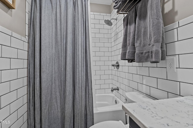 full bath featuring shower / bath combo, tile walls, and toilet