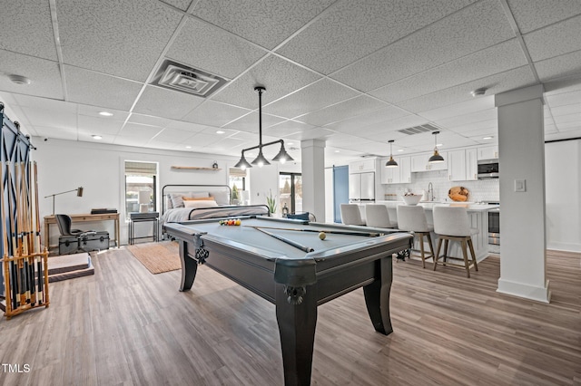 playroom with visible vents, wood finished floors, and pool table