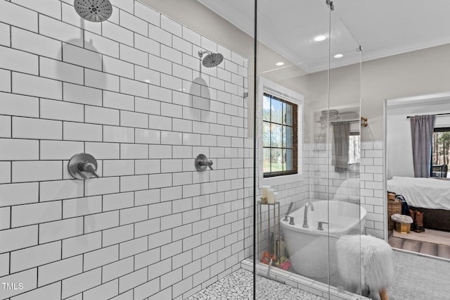 full bath with ensuite bathroom, ornamental molding, a freestanding tub, and tile walls