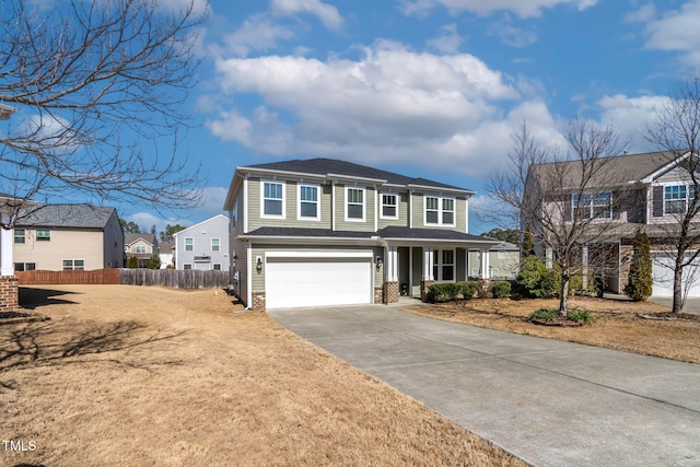 traditional home with a porch, an attached garage, fence, driveway, and a residential view