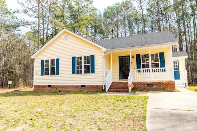 view of front of house featuring crawl space, covered porch, a front lawn, and roof with shingles