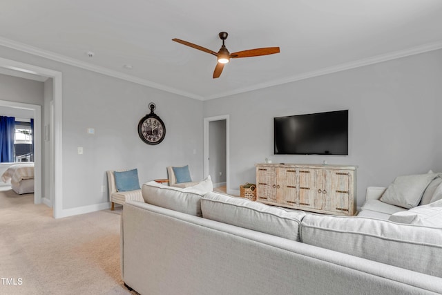 living room featuring a ceiling fan, baseboards, crown molding, and light colored carpet