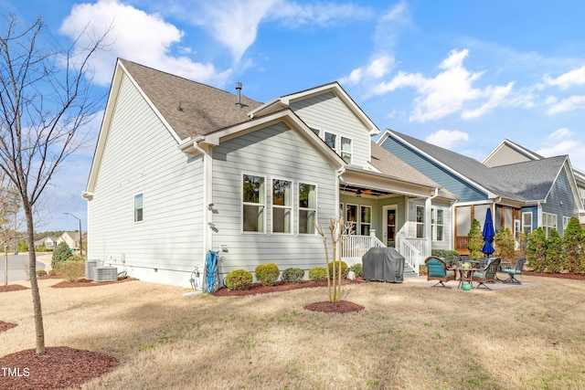 back of property featuring roof with shingles, a yard, a patio, central AC unit, and ceiling fan