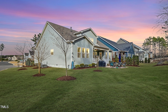 view of front of property featuring a front lawn and a patio