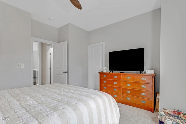 bedroom with a ceiling fan and carpet flooring