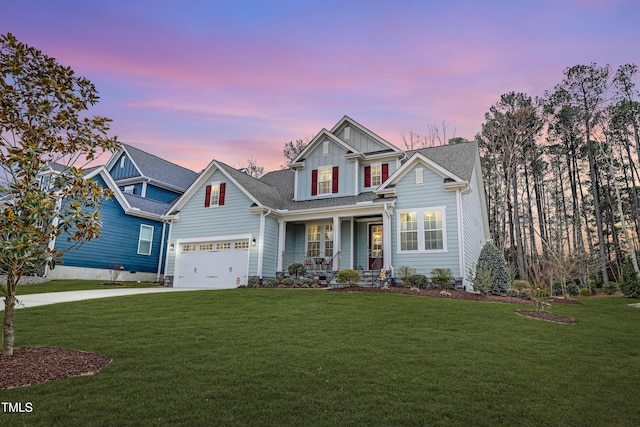 craftsman house with a garage, concrete driveway, board and batten siding, and a front yard