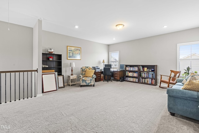 living area with carpet, baseboards, and recessed lighting