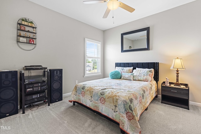 carpeted bedroom featuring ceiling fan and baseboards