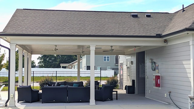 view of patio with driveway, fence, outdoor lounge area, and a ceiling fan