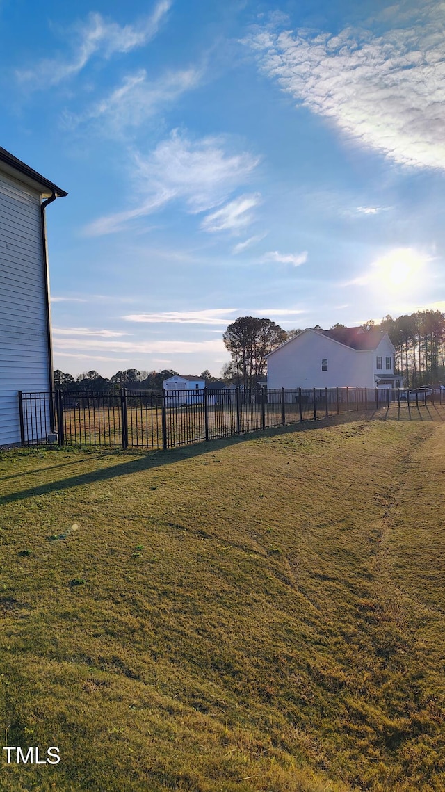 view of yard featuring a rural view and fence