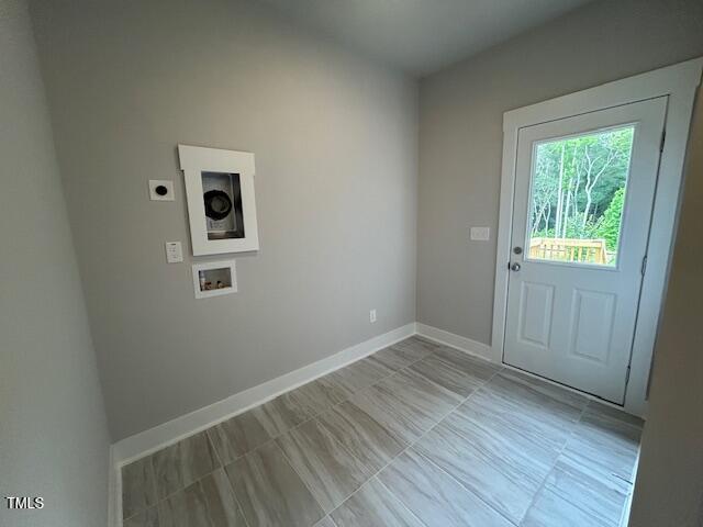 504 Yeowell Dr, Chapel Hill, NC 27514 - washroom featuring electric dryer hookup, washer hookup, and light tile patterned floors