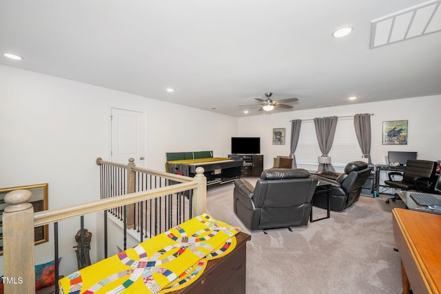 living room with a ceiling fan, recessed lighting, and light colored carpet