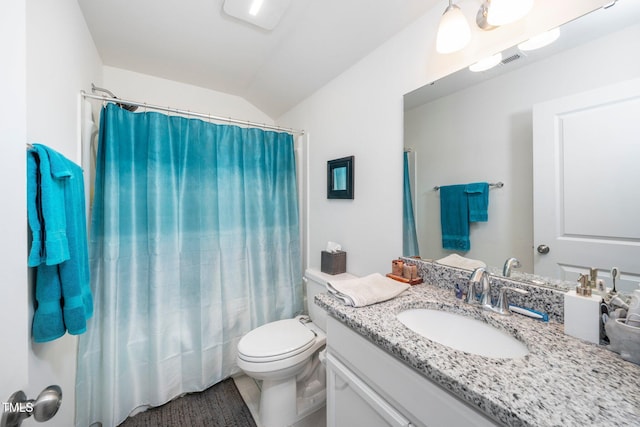 full bathroom featuring lofted ceiling, visible vents, vanity, and toilet