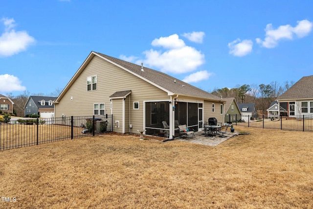 rear view of property featuring a yard, a patio area, a fenced backyard, and a residential view