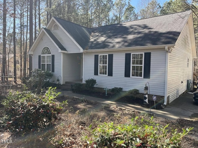 view of front of house with roof with shingles