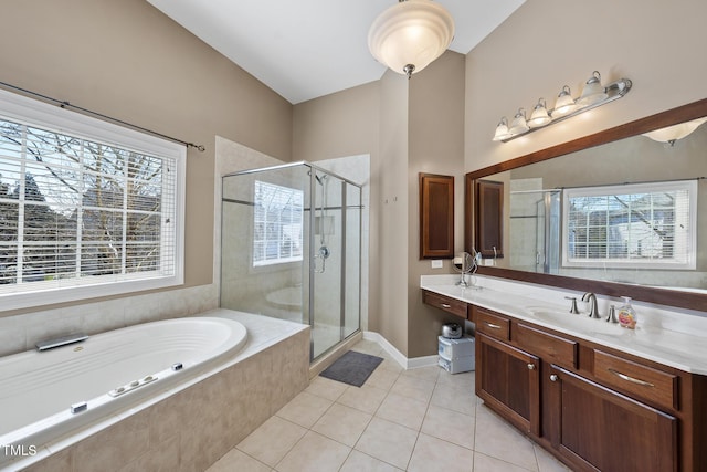 bathroom with tile patterned flooring, a garden tub, a shower stall, and vanity