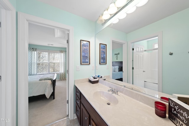 ensuite bathroom featuring ensuite bathroom and vanity