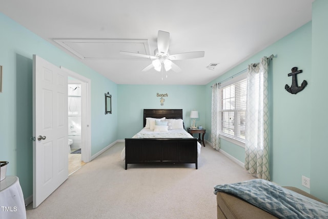 bedroom with baseboards, visible vents, and light colored carpet