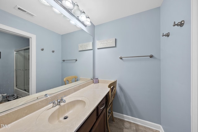 full bathroom with visible vents, a shower with door, vanity, and baseboards