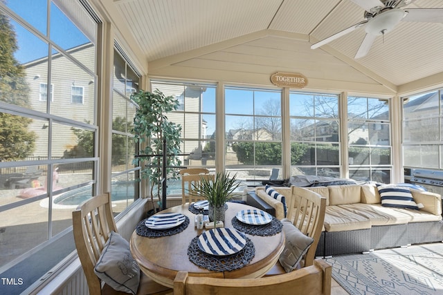 sunroom with lofted ceiling and ceiling fan