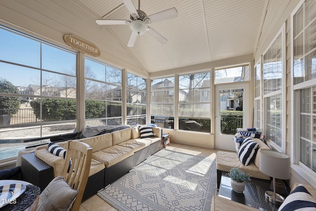 sunroom featuring a ceiling fan and lofted ceiling