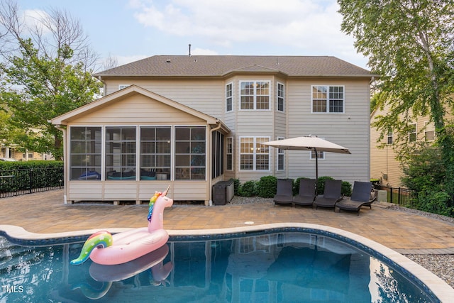 109 Skywater Ln, Holly Springs, NC 27540 - back of property with a sunroom and a patio area