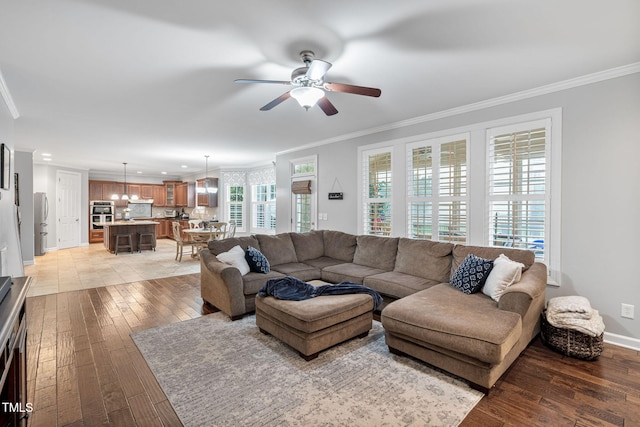 109 Skywater Ln, Holly Springs, NC 27540 - living area with crown molding, a ceiling fan, light wood-type flooring, and recessed lighting