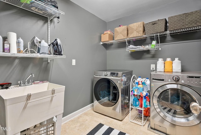 109 Skywater Ln, Holly Springs, NC 27540 - laundry area featuring washing machine and dryer and tile patterned flooring