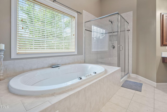 109 Skywater Ln, Holly Springs, NC 27540 - full bathroom featuring a bath, a stall shower, and tile patterned flooring