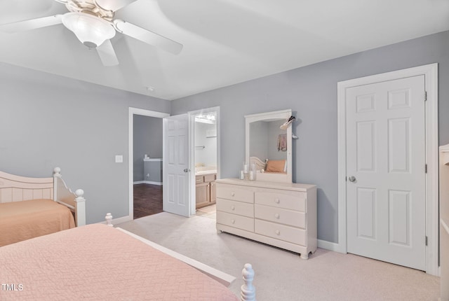 109 Skywater Ln, Holly Springs, NC 27540 - bedroom with light colored carpet, ensuite bathroom, and a ceiling fan