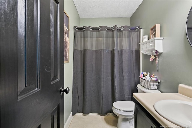 bathroom with a shower with curtain, a textured ceiling, toilet, and vanity