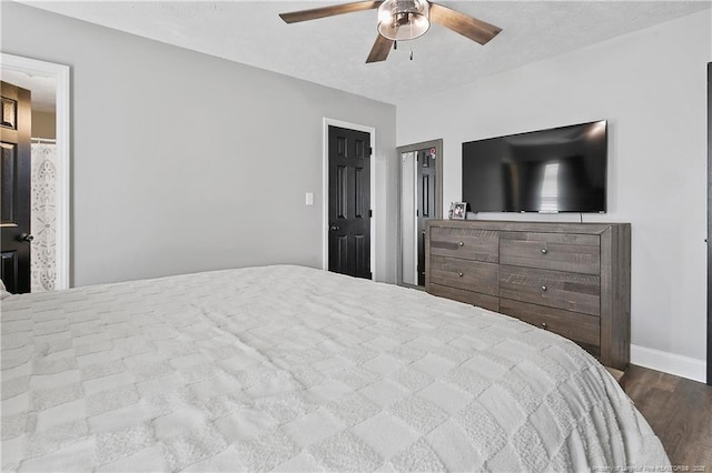 bedroom with ceiling fan, light wood-style floors, a textured ceiling, and baseboards