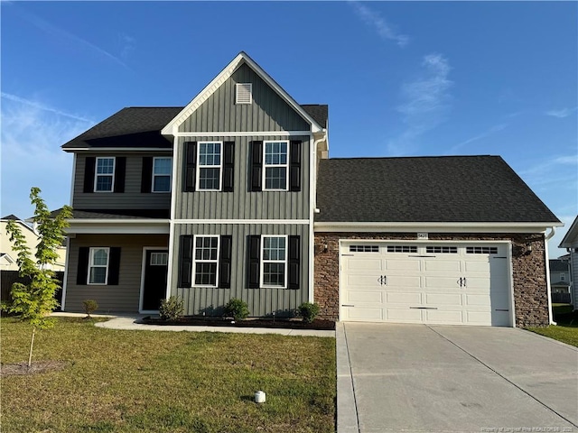 5427 Debut Ave, Hope Mills, NC 28348 - view of front of property featuring board and batten siding, a garage, concrete driveway, a front yard, and roof with shingles