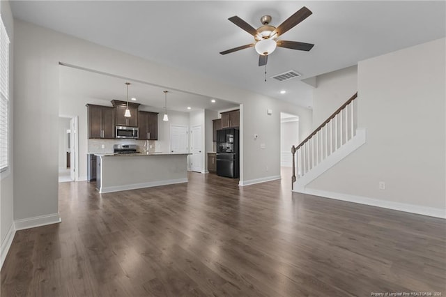 5427 Debut Ave, Hope Mills, NC 28348 - unfurnished living room with a ceiling fan, stairs, dark wood-type flooring, recessed lighting, and a sink