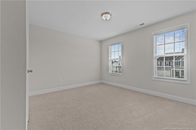 5427 Debut Ave, Hope Mills, NC 28348 - spare room featuring carpet flooring and baseboards