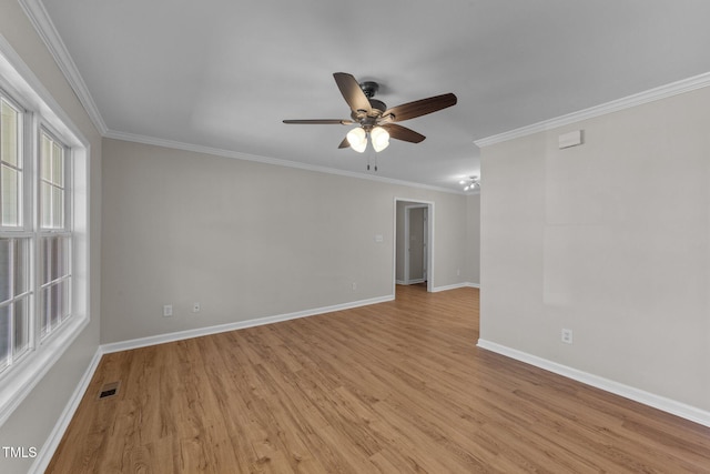 unfurnished room with light wood finished floors, baseboards, visible vents, a ceiling fan, and ornamental molding