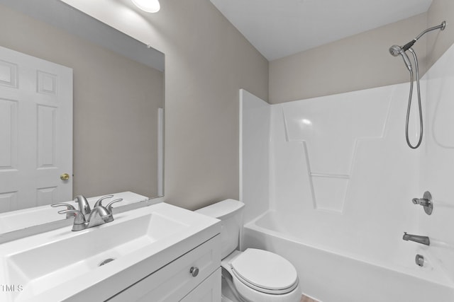 bathroom featuring toilet,  shower combination, and vanity