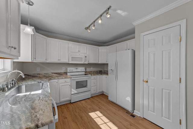 kitchen featuring white appliances, a sink, white cabinetry, and crown molding