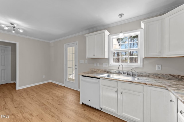 kitchen featuring light wood finished floors, white cabinets, ornamental molding, white dishwasher, and a sink