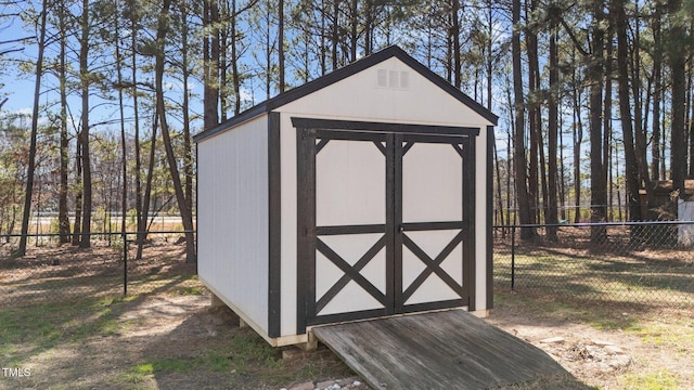 view of shed with a fenced backyard