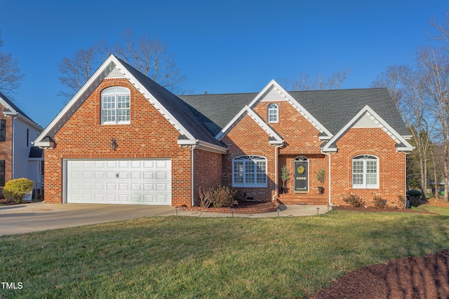 traditional-style house featuring driveway, brick siding, a front lawn, and a shingled roof