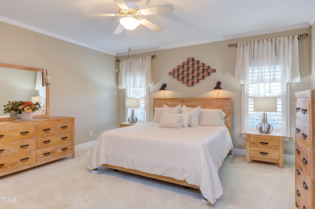 bedroom featuring light carpet, ceiling fan, baseboards, and ornamental molding